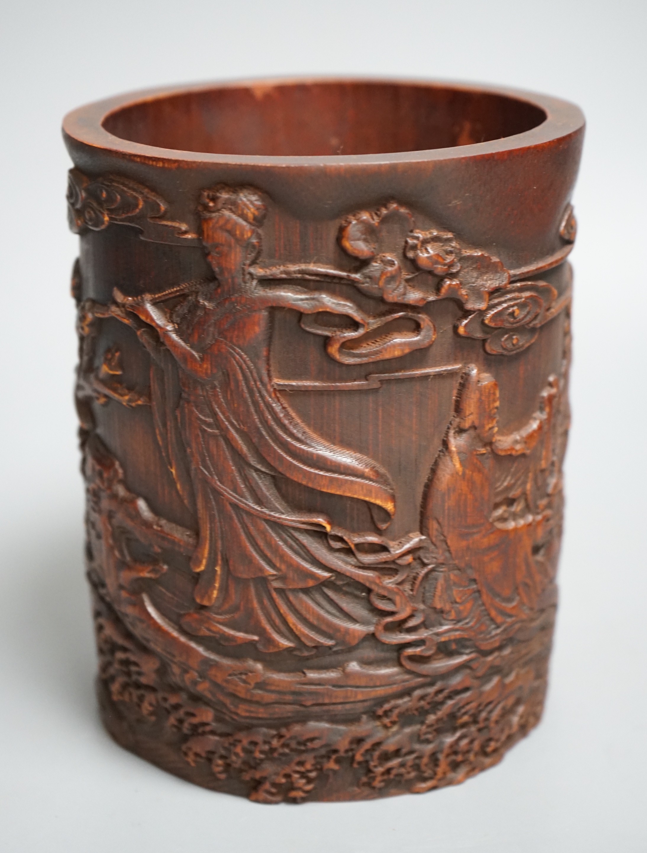 A Chinese 'immortals' carved bamboo brush pot, 16cm